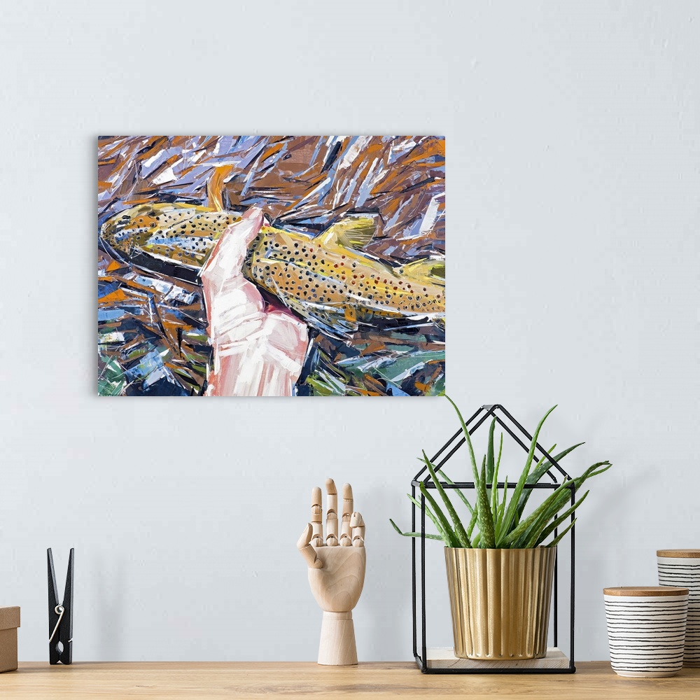 A bohemian room featuring Contemporary painting of a hand holding a brown fish above a rushing stream.