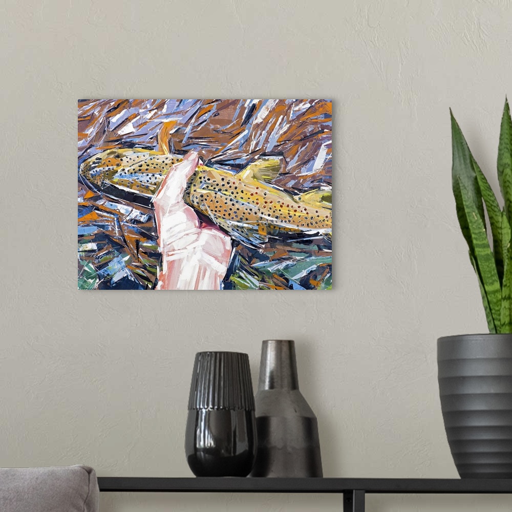 A modern room featuring Contemporary painting of a hand holding a brown fish above a rushing stream.