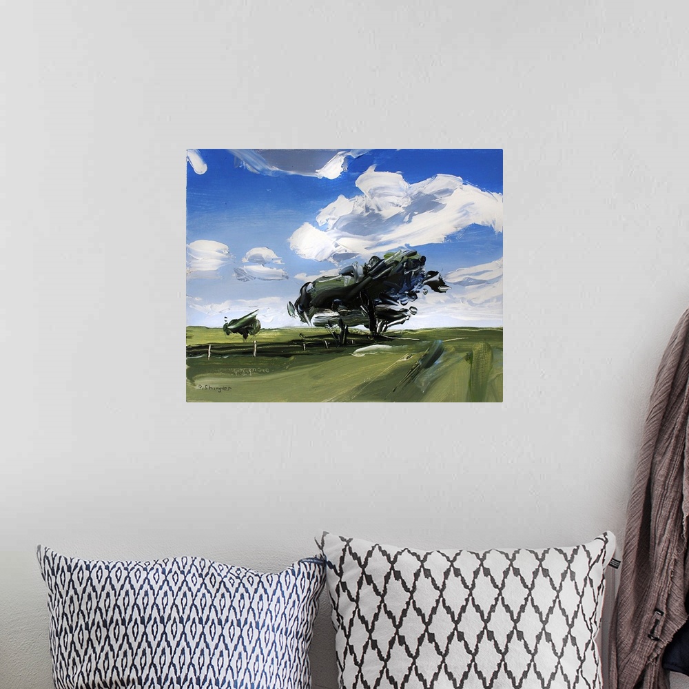 A bohemian room featuring A contemporary painting of a green field with trees under a sky filled with gray clouds.