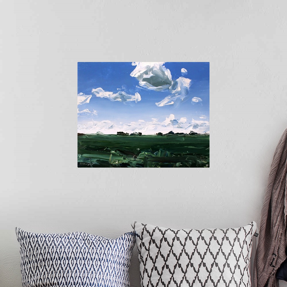 A bohemian room featuring A contemporary painting of a green field under a sky filled with gray clouds.