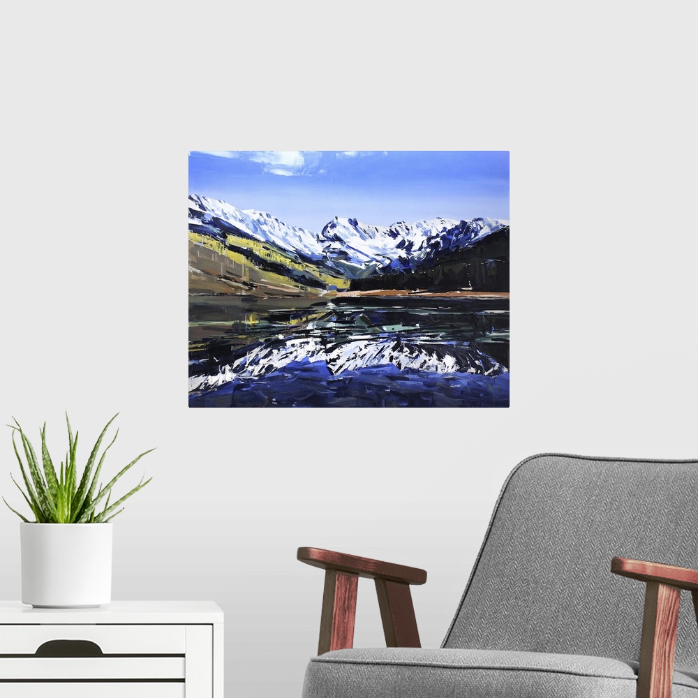 A modern room featuring Contemporary palette knife painting of a lake with snow covered mountains reflecting in the water.