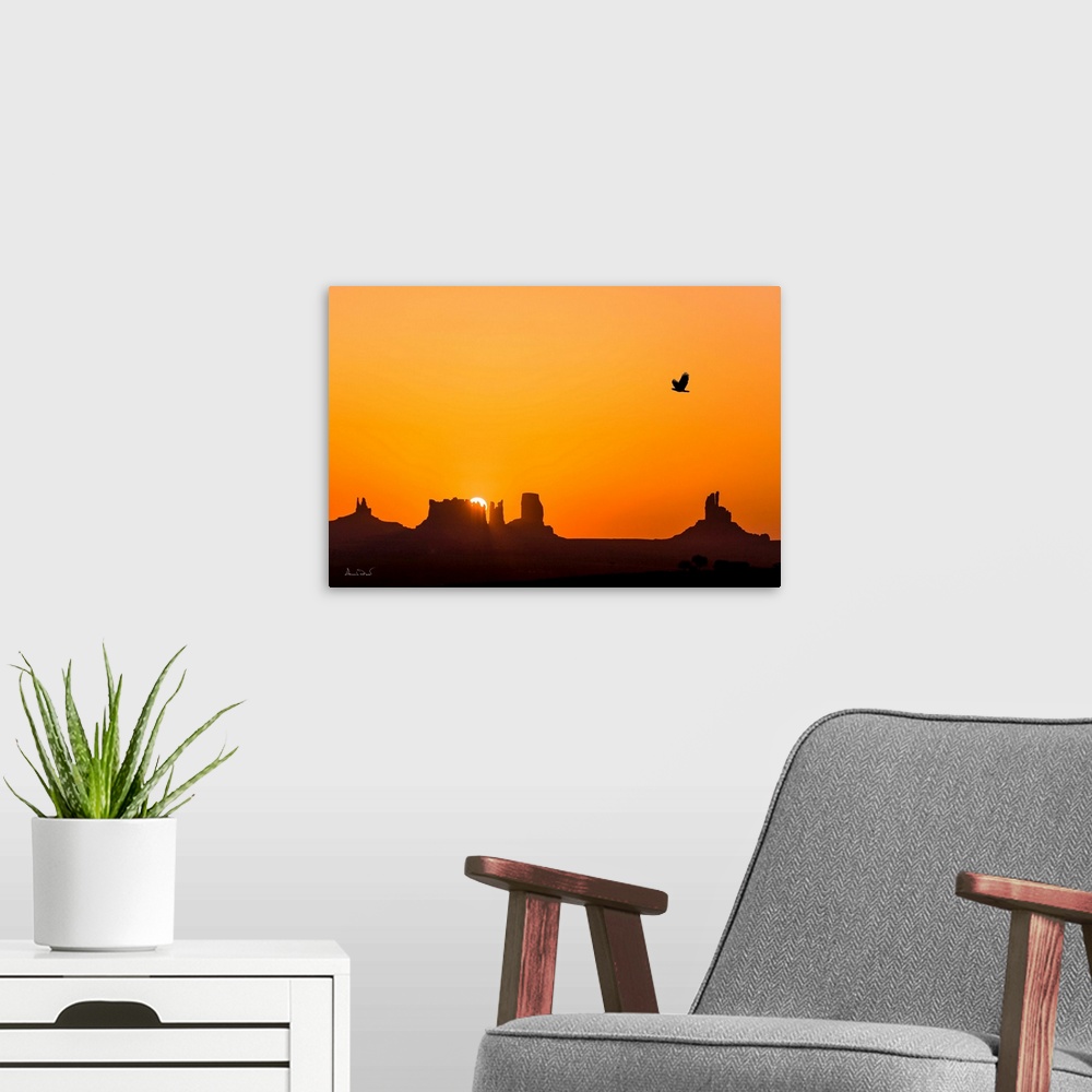 A modern room featuring Composite of glorious sunrise over the mittens of Monument Valley with a silhouette of a Bald Eag...