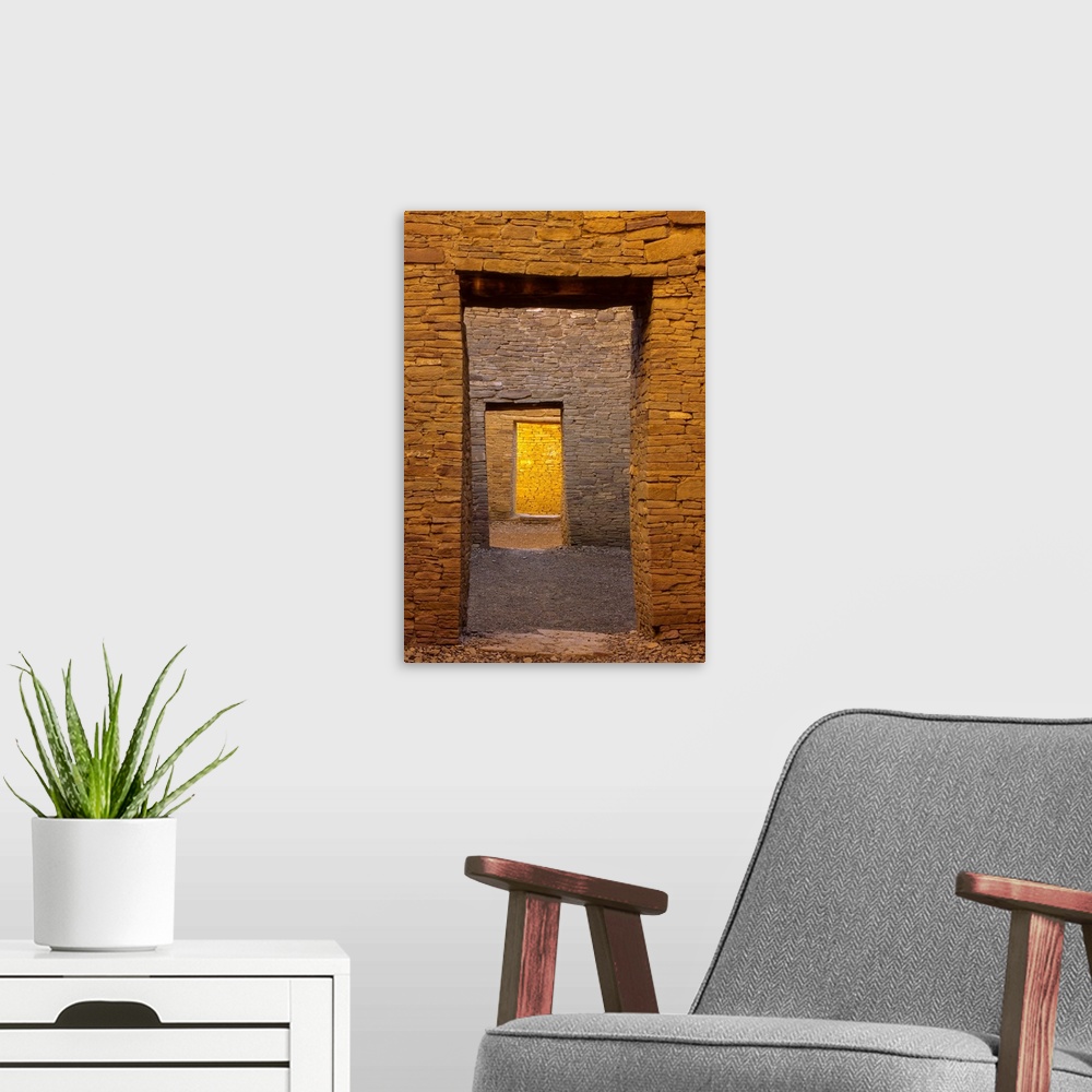 A modern room featuring Stone doorway with room views beyond at Bonito Pueblo, Chaco Canyon, New Mexico, USA.
