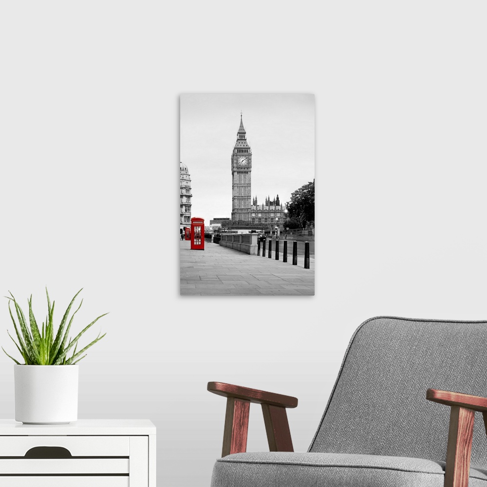 A modern room featuring A traditional red phone booth in London with Big Ben in the background.