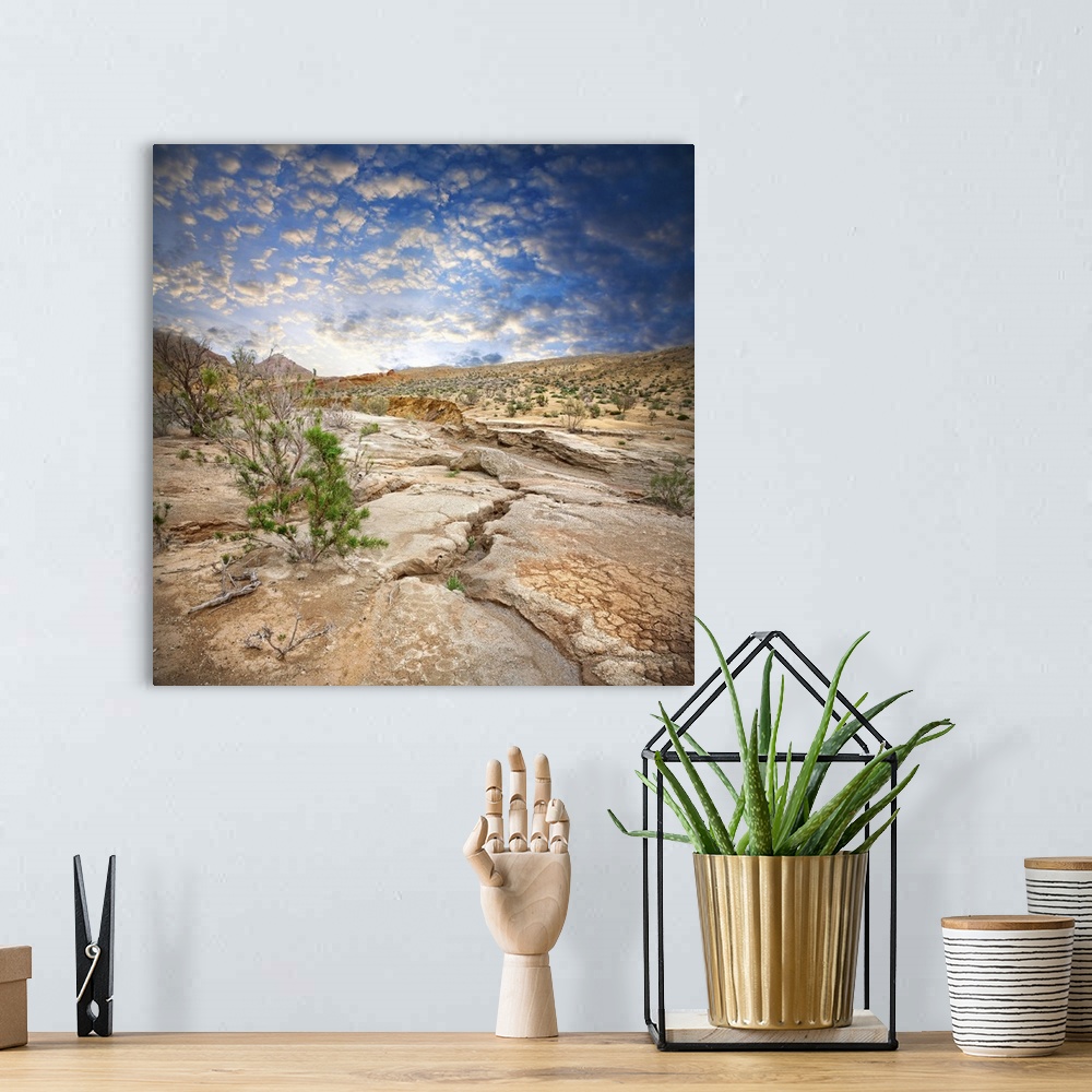 A bohemian room featuring Aktau Mountains scenery with drought earth at dramatic blue sky in National Park Altyn Emel in Ka...