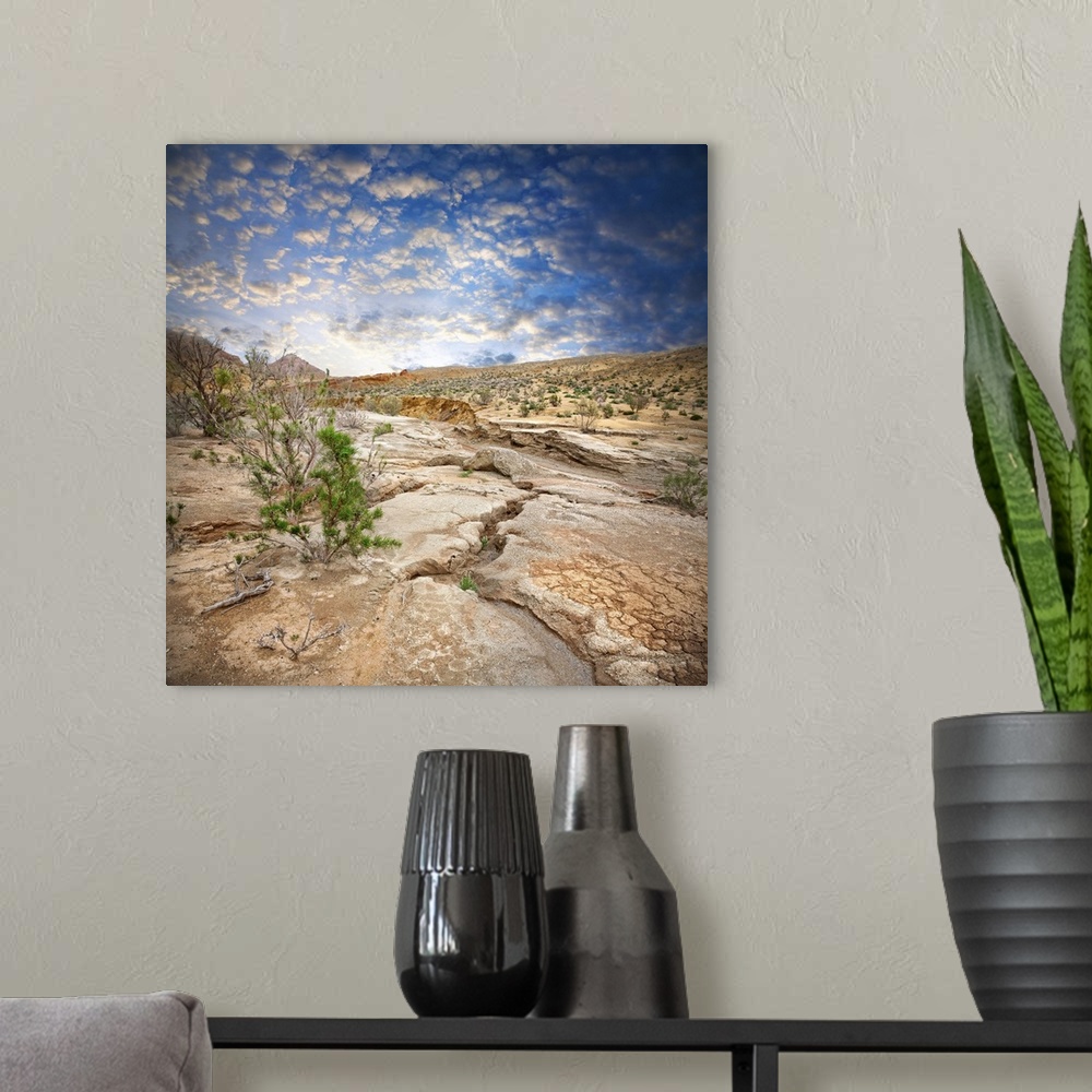 A modern room featuring Aktau Mountains scenery with drought earth at dramatic blue sky in National Park Altyn Emel in Ka...