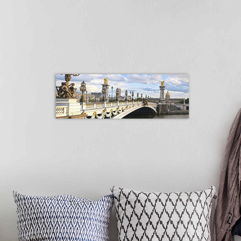 A bohemian room featuring Panoramic view of the Alexandre III bridge in Paris, France.