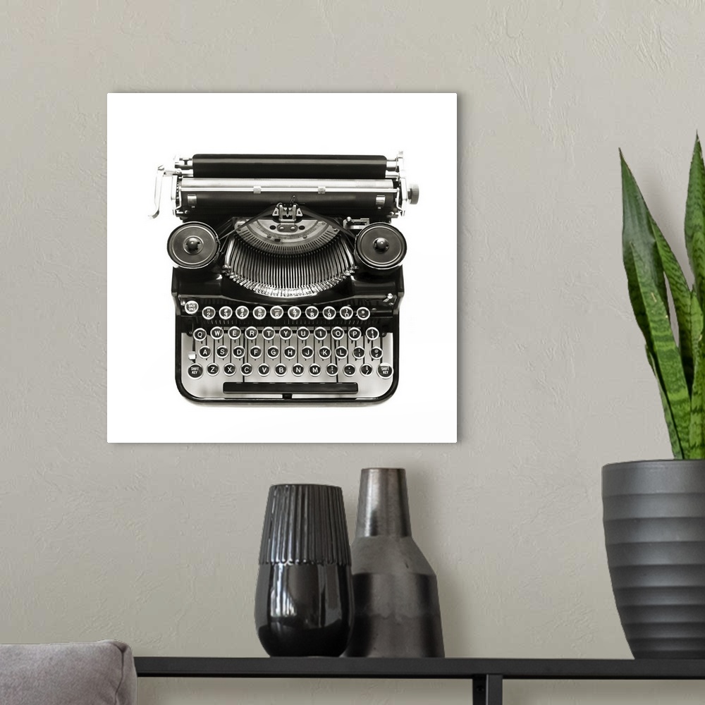 A modern room featuring Antique typewriter against a crisp white backdrop.