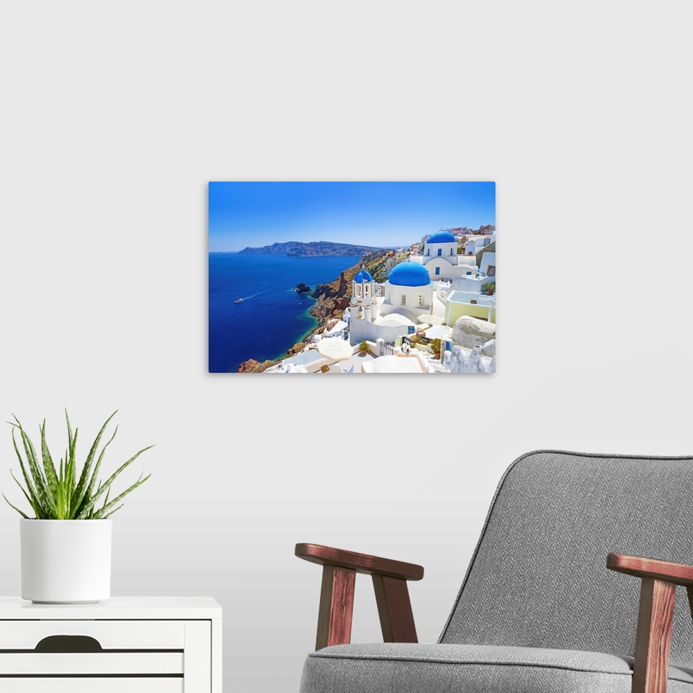 A modern room featuring White architecture of Oia village on Santorini island, Greece.