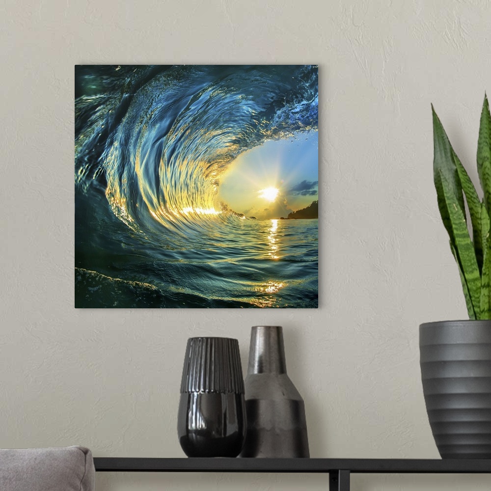 A modern room featuring Rough colored ocean wave falling down at sunset time.
