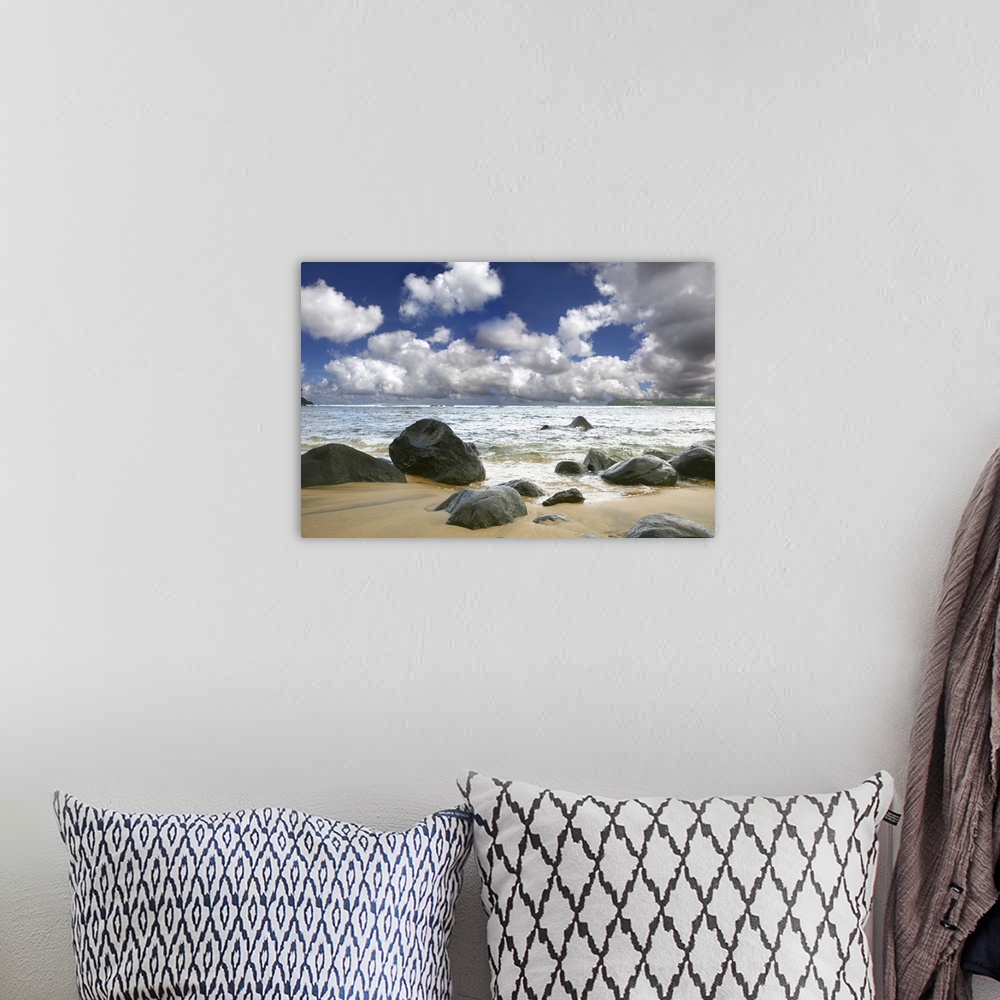 A bohemian room featuring Beautiful sky over the ocean waves at the beach.