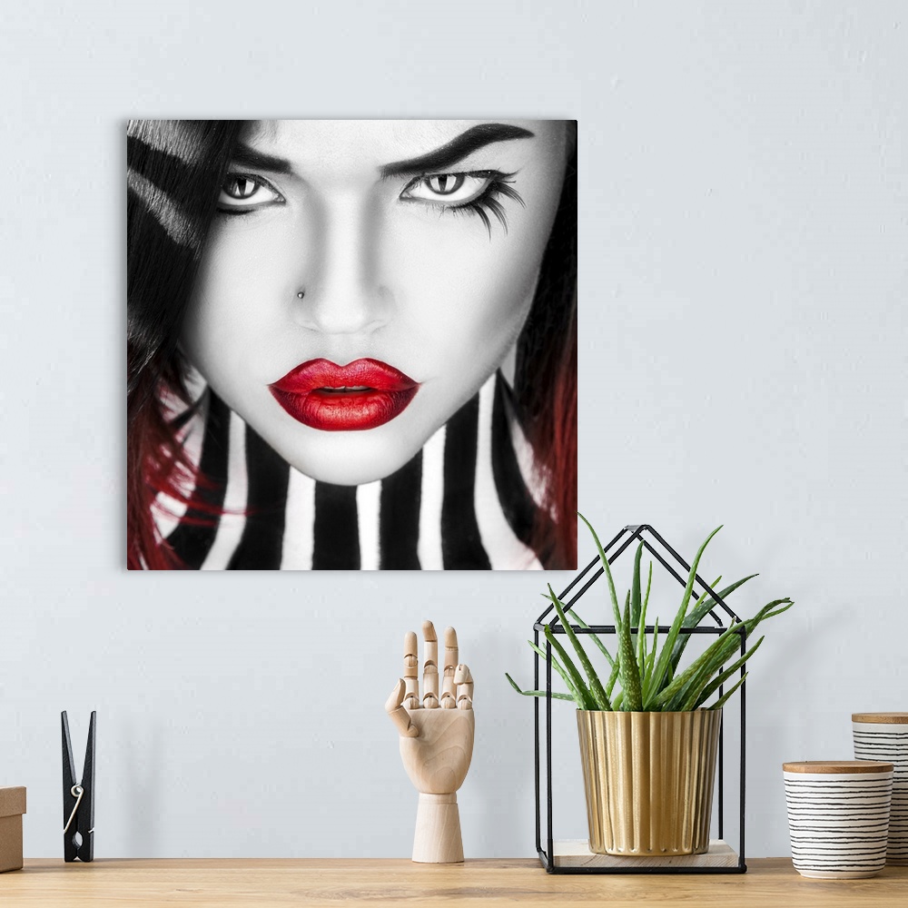 A bohemian room featuring Black and white portrait of beauty woman with red lips in studio.