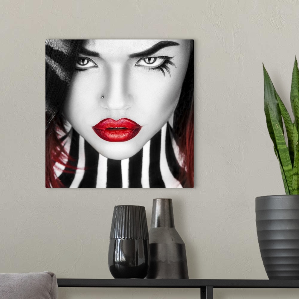 A modern room featuring Black and white portrait of beauty woman with red lips in studio.