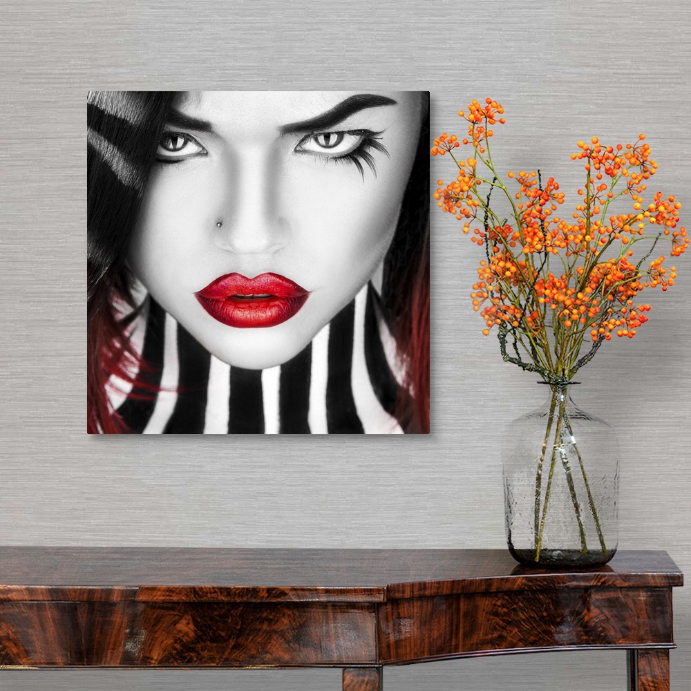 A traditional room featuring Black and white portrait of beauty woman with red lips in studio.