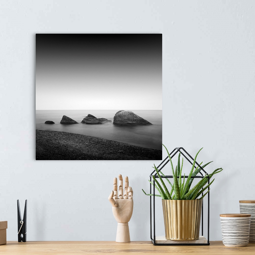 A bohemian room featuring Daytime long exposure seascape with object in the sea. The photo taken in black and white. Black ...