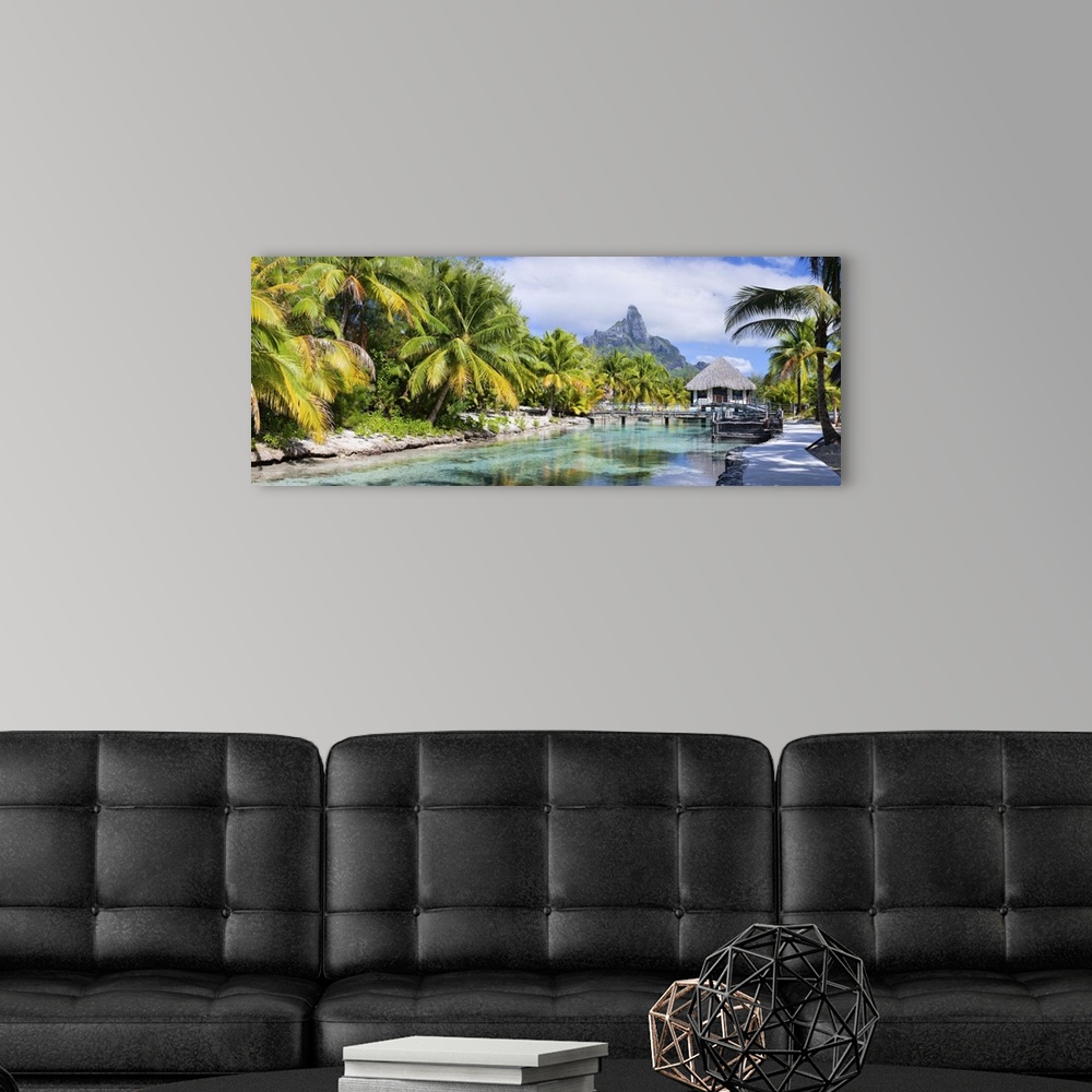 A modern room featuring Panorama of a beautiful coast with Otemanu mountain view on Bora Bora island.