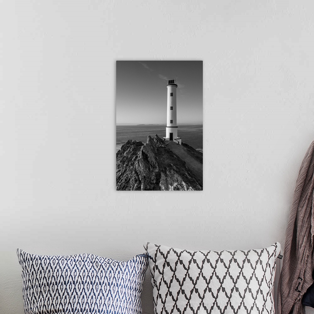 A bohemian room featuring Cabo home lighthouse, black and white.