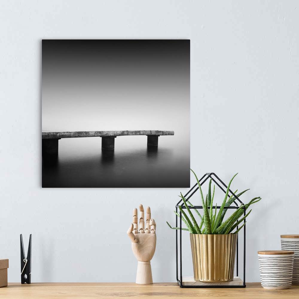 A bohemian room featuring Daytime long exposure seascape with object in the sea. The photo taken in black and white. Black ...