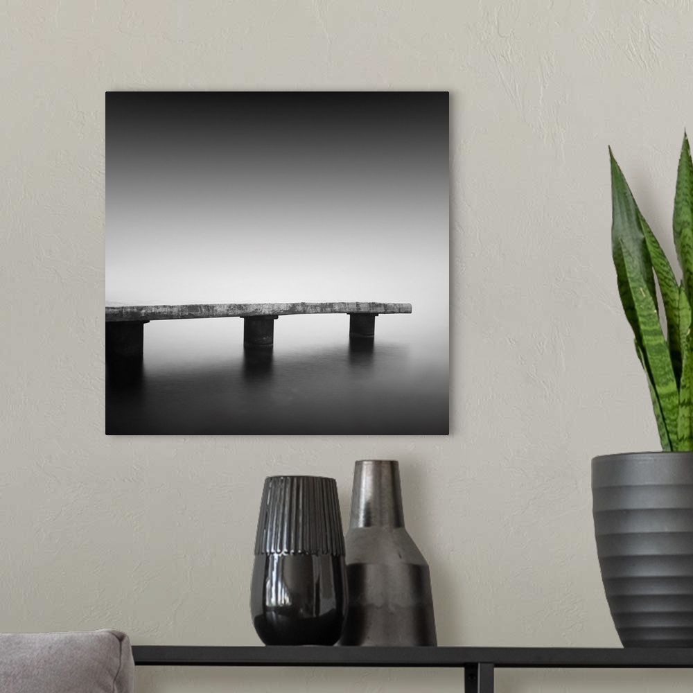 A modern room featuring Daytime long exposure seascape with object in the sea. The photo taken in black and white. Black ...