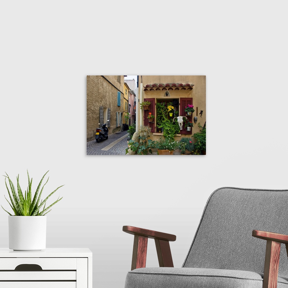 A modern room featuring The seaside town of cassis, old street, European town, a journey through France.