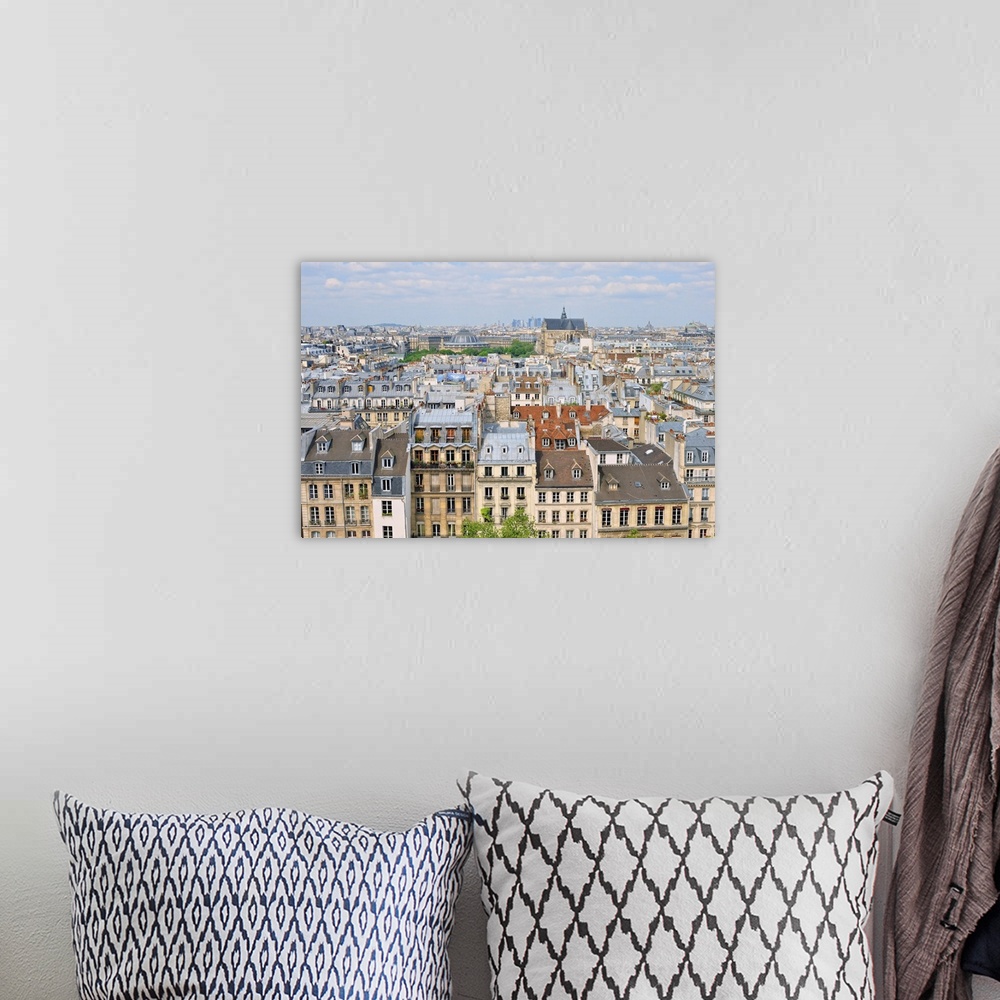 A bohemian room featuring Aerial panorama above houses rooftops in a Paris.