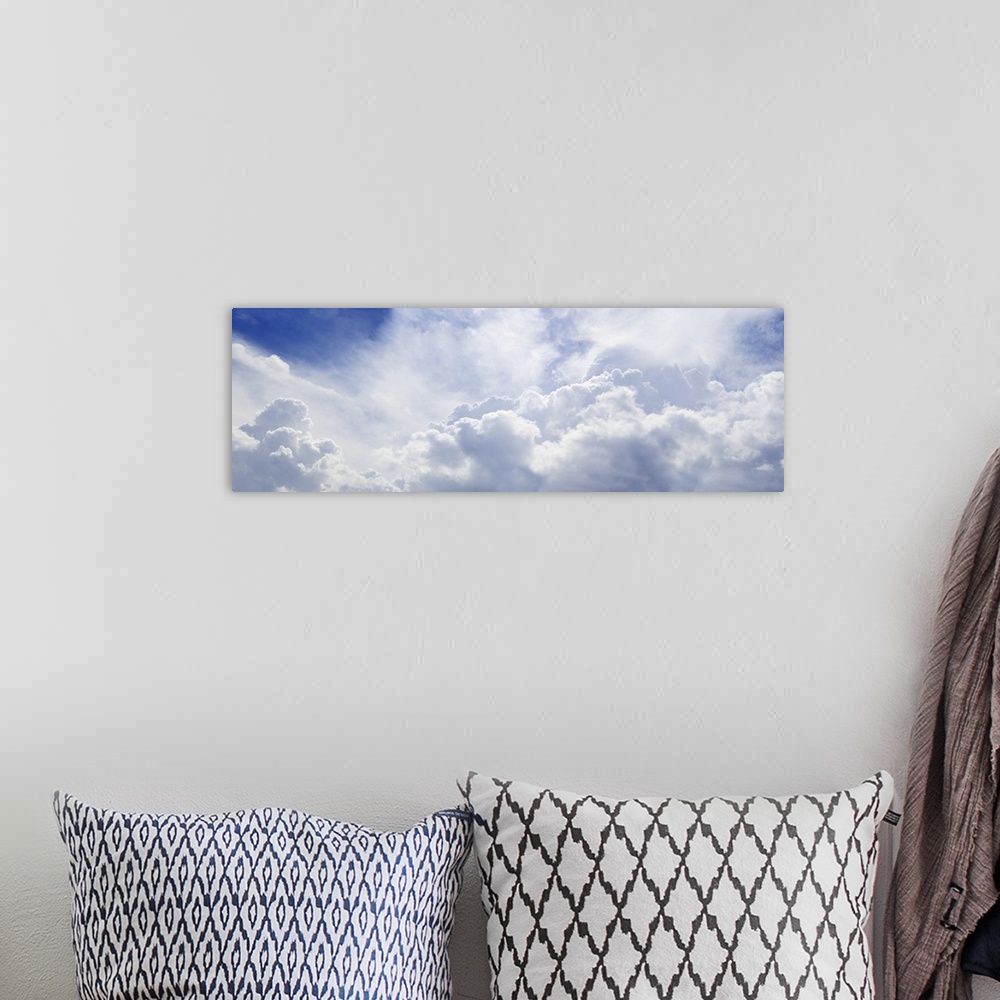 A bohemian room featuring Panoramic shot of a blue sky with lots of fluffy clouds.
