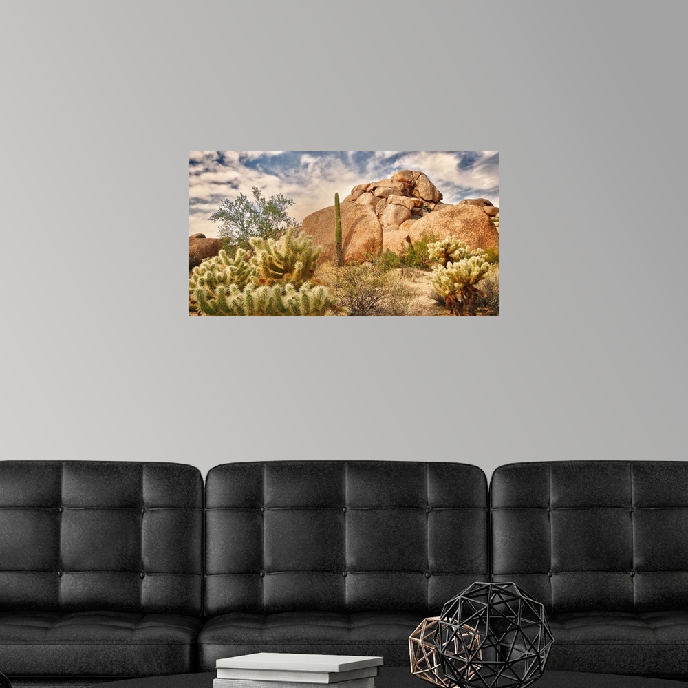 A modern room featuring Beautiful desert landscape with red rock buttes and glowing sky with little fluffy clouds.
