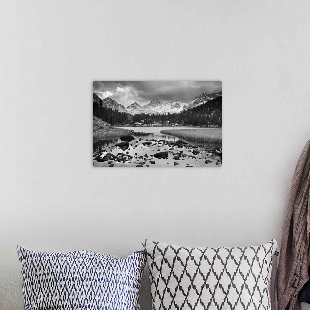 A bohemian room featuring Dramatic Landscape of a mountain in black and white.