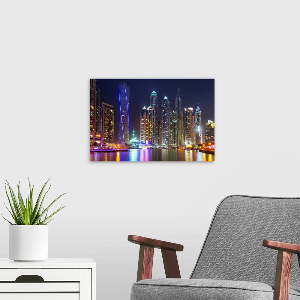 A modern room featuring Dubai marina at night in United Arab Emirates.