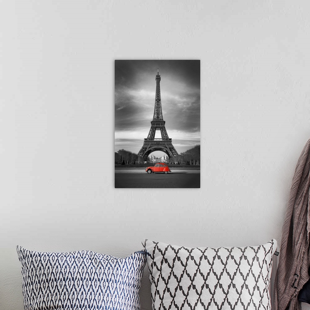 A bohemian room featuring Eiffel Tower and old red car in Paris.