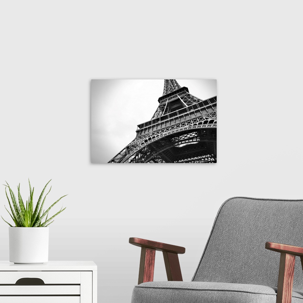 A modern room featuring Amazing cityscape of Paris with the beautiful Eiffel tower in black and white in the foreground.