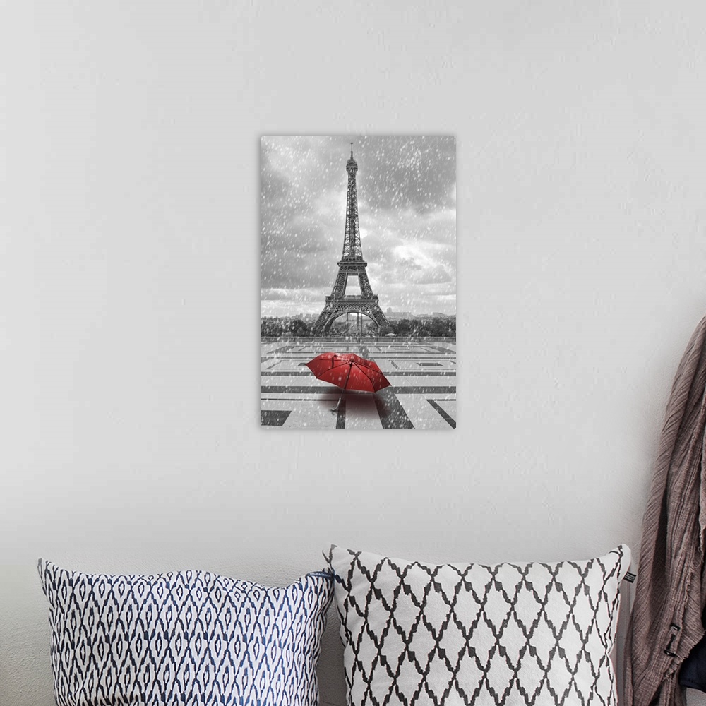 A bohemian room featuring Eiffel tower in the rain with red umbrella. Black and white photo with red element.