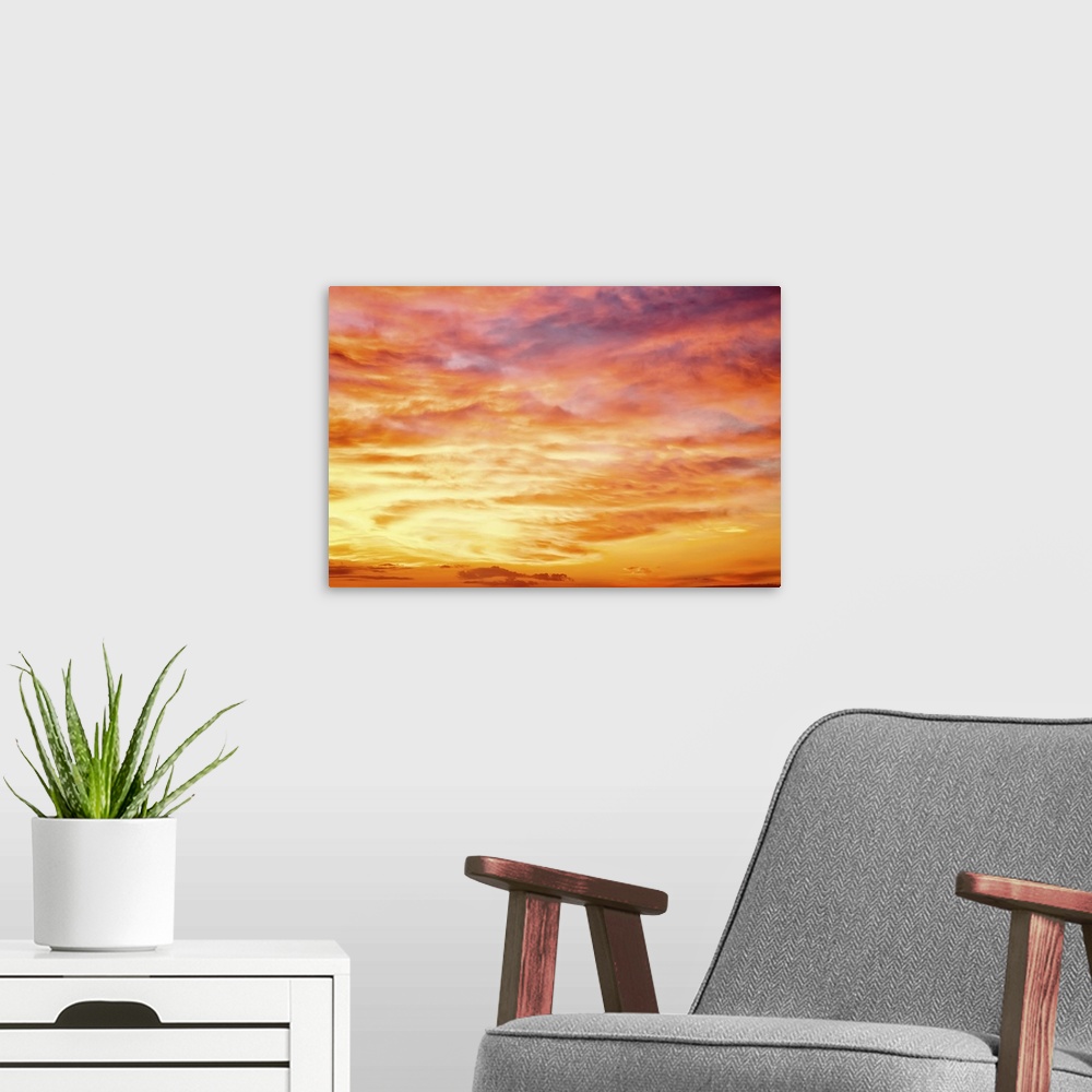 A modern room featuring Fiery orange sunset sky. Beautiful sky.