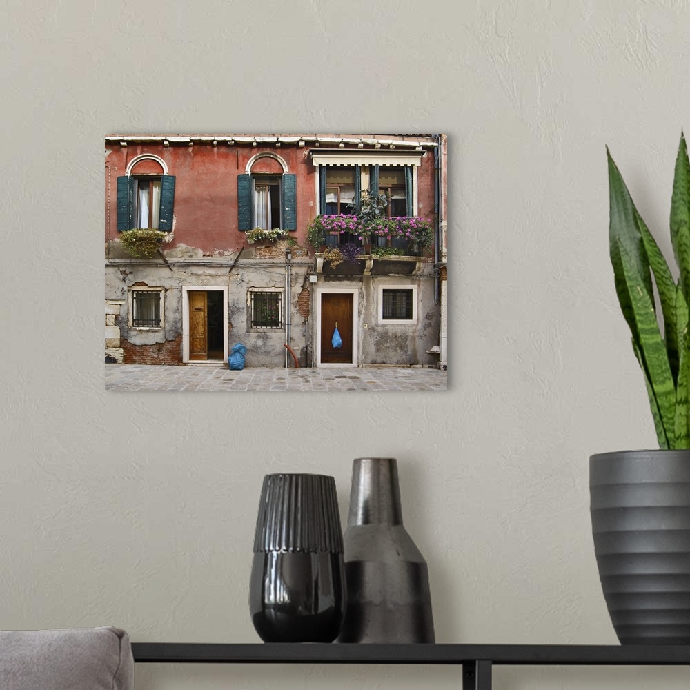 A modern room featuring Old house facade, Venice, Italy.