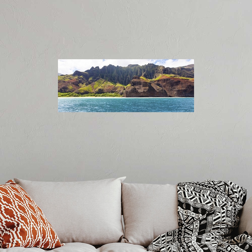 A bohemian room featuring Panorama of dramatic cliffs at Na Pali coast at Kauai, Hawaii, view from water.
