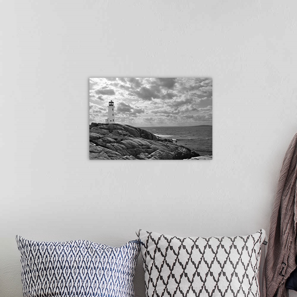 A bohemian room featuring Lighthouse at Peggy's Cove, Nova Scotia in black and white with dramatic clouds in sky.