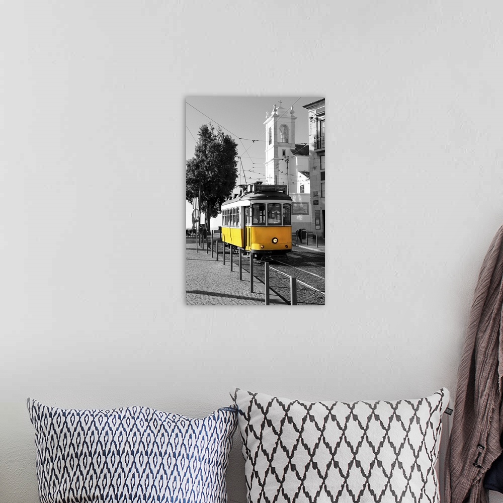 A bohemian room featuring Old yellow tram over black and white background in Lisbon, Portugal.