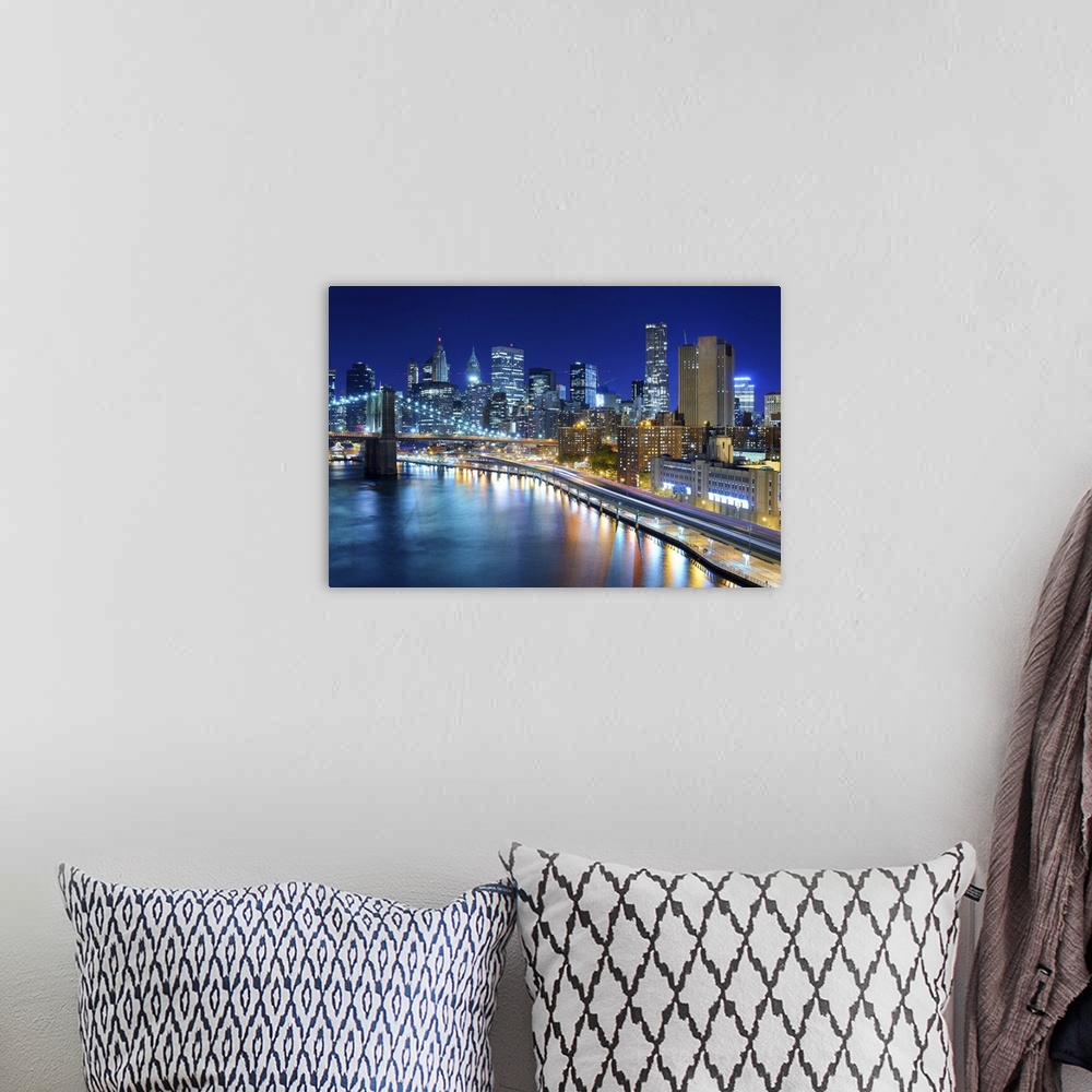 A bohemian room featuring View of the financial district of Manhattan at night in New York City.