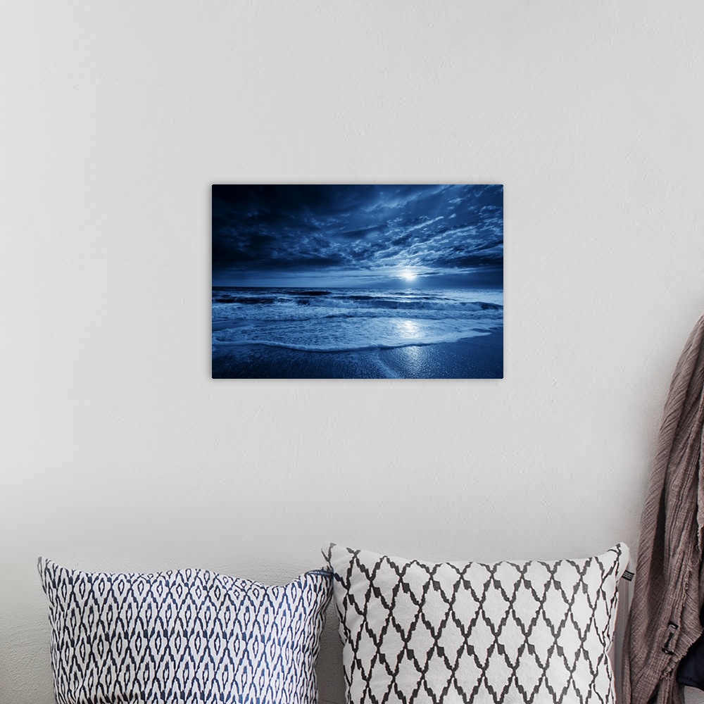 A bohemian room featuring This is a photographic illustration of a beautiful midnight-blue ocean moonrise with dramatic sky...