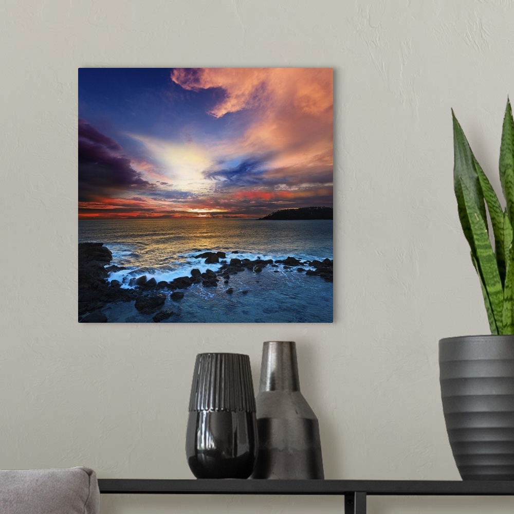 A modern room featuring Ocean sunset with great cloudscape.