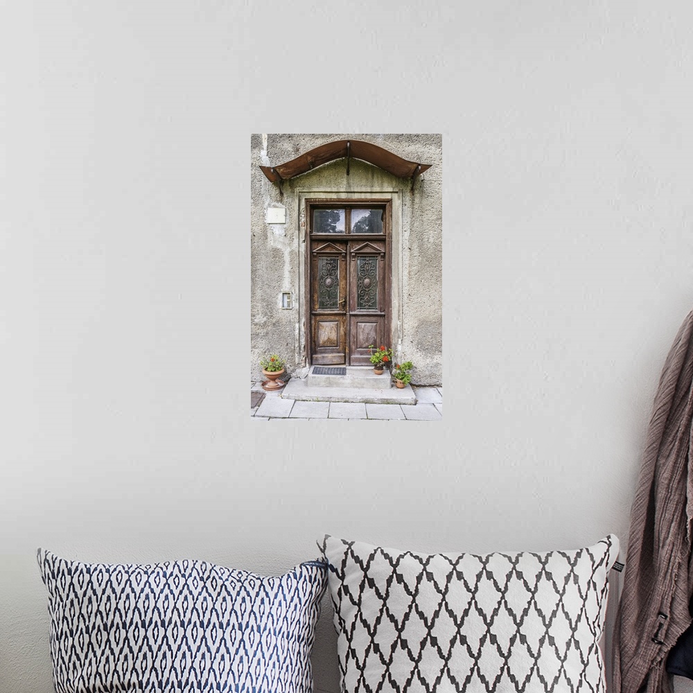 A bohemian room featuring Old door in an ancient European stone house.