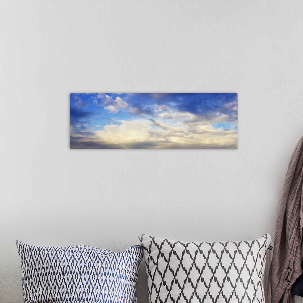 A bohemian room featuring Panoramic view of cloudy sky.