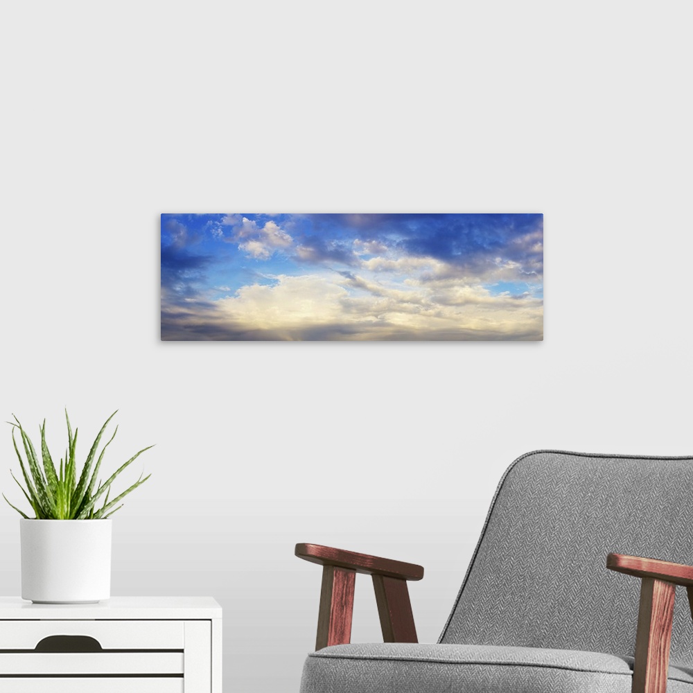 A modern room featuring Panoramic view of cloudy sky.