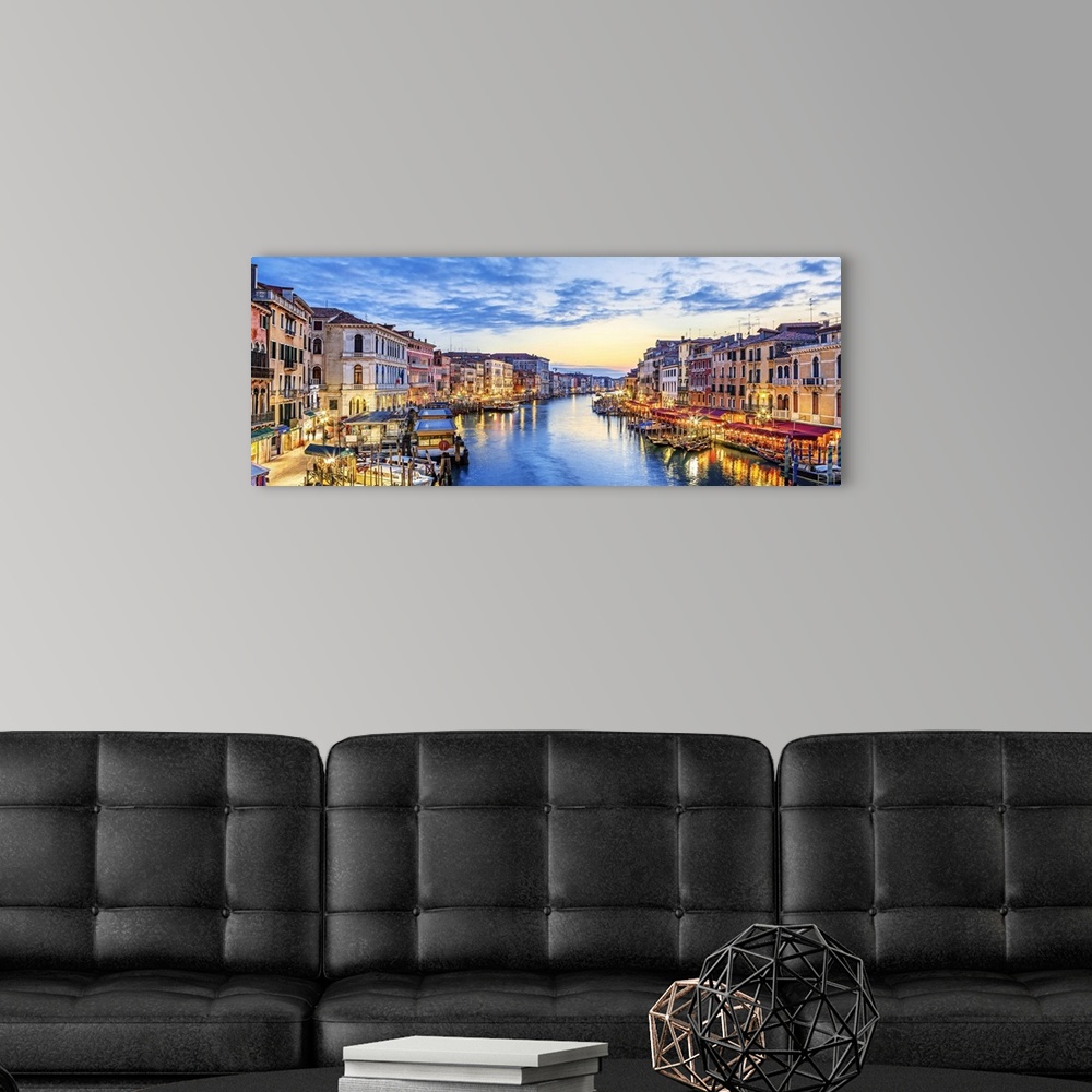 A modern room featuring Panoramic view of the famous grand canal at sunset, Venice.