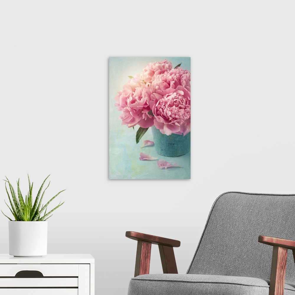 A modern room featuring Peony flowers in a vase.