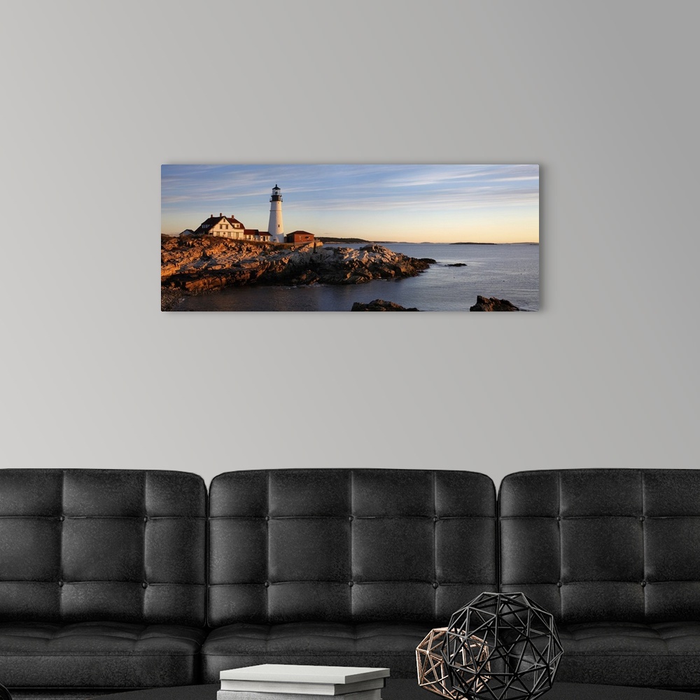 A modern room featuring The serene beauty of the Portland Head Light At Dawn, Portland Maine.