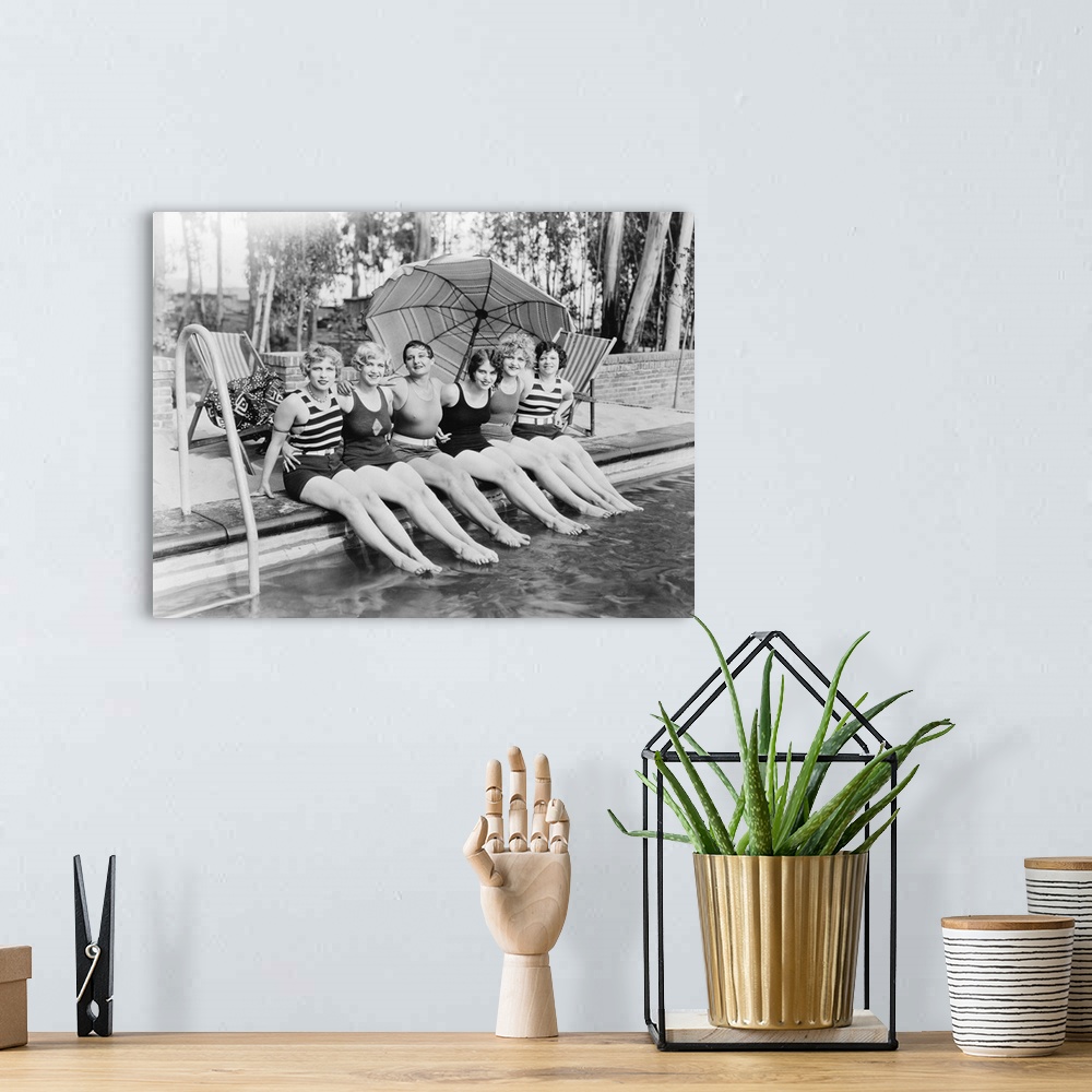 A bohemian room featuring Vintage portrait of female friends at a pool.