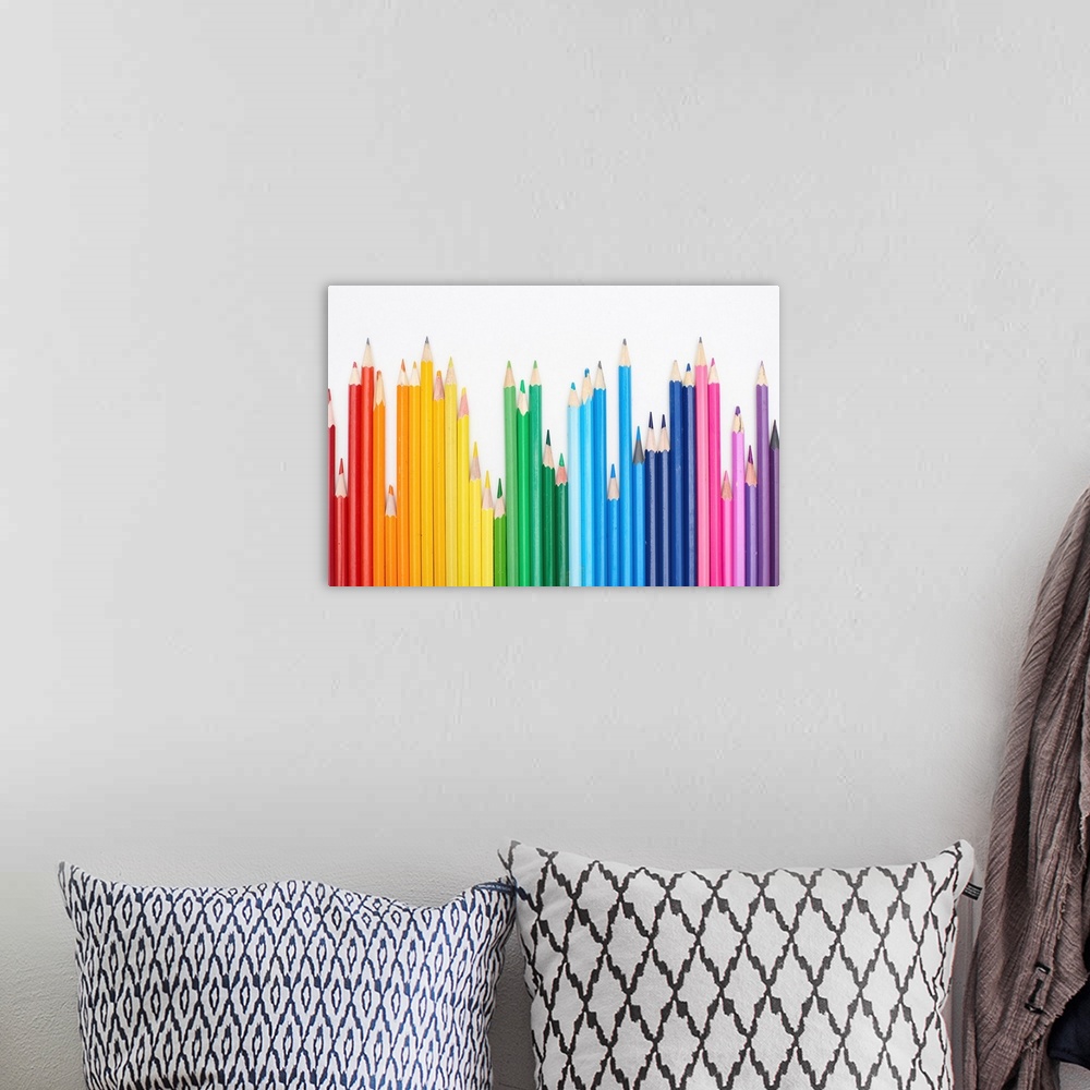 A bohemian room featuring Rainbow spectrum made with color pencils isolated on white.