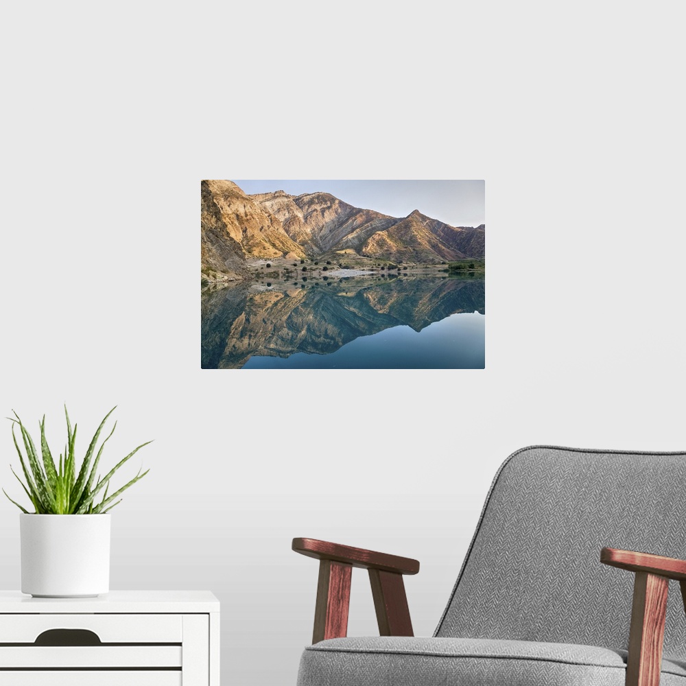 A modern room featuring River Shrouded In Mountains
