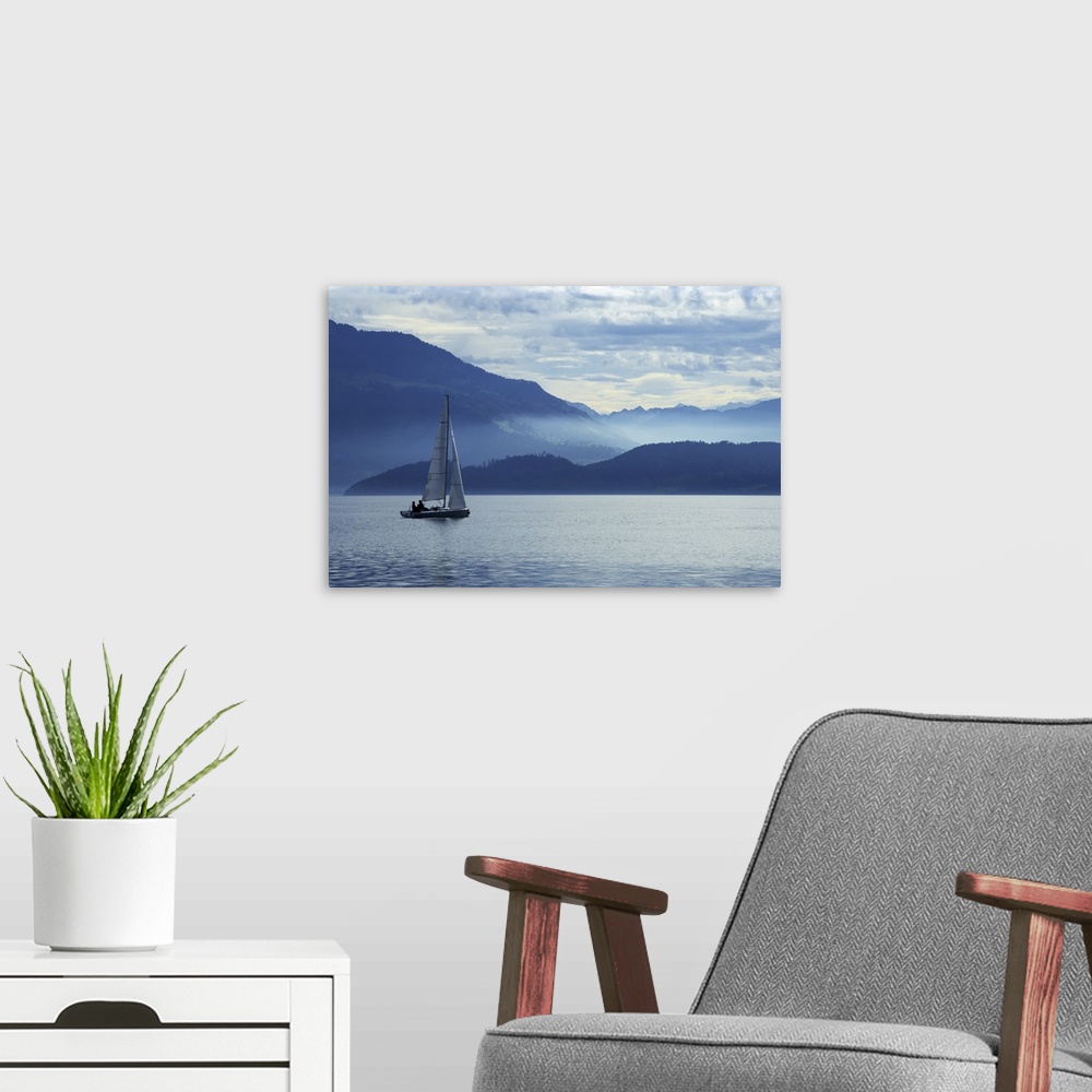 A modern room featuring Sailing on Lake Zug in Switzerland with the Alps in the background.